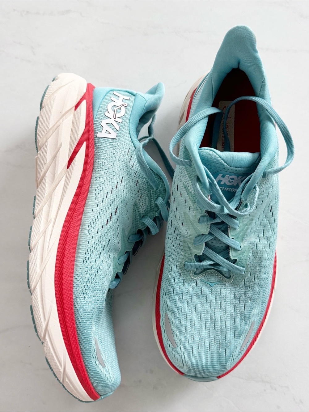 Hoka Women's one one Clifton Running Shoes in Light Blue and Coral